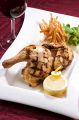 料理メニュー写真 骨付きチキンのディアブル風