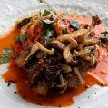 料理メニュー写真&nbsp;ホロホロ鳥のパルミジャーノ焼き，燻製モッツァレラのスパゲッティ 辛いトマトソース
