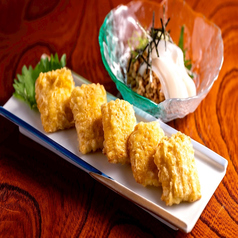 【熱々の衣でつつんだ、夏の贈り物】みずみずしさが炸裂する季節の一皿 とうもろこしの天ぷら 730円(税込)の写真