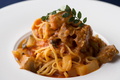 料理メニュー写真 完熟トマトと玄米豚のラグーのタリオリーニ