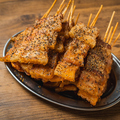 料理メニュー写真 バリとん焼き 黒(1本）