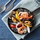 〆のイカ墨海鮮パエリア Squid ink and seafood paella