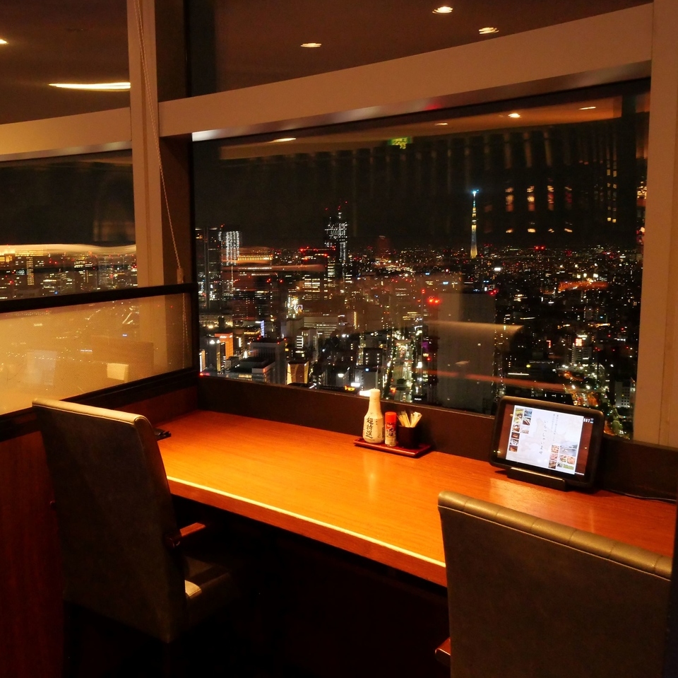 『北海道 カレッタ汐留店』の夜景が見える店内