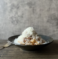 たっぷりと熟成チーズをかけた和牛のボロネーゼ