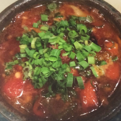 じっくり煮込んだ牛すじのトマト煮込みの写真