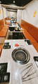 【焼肉フロア】落ち着きある雰囲気のテーブル席。広々としたスペースでゆったりと焼肉・お食事をお楽しみいただけます。