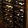 ソムリエが厳選したワインがずらりと並ぶワインセラー。当店自慢のお料理に合う逸品を多数取り揃えております。