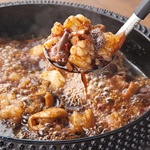 ミックスホルモンのタレ焼き「KUROGANEもつ焼き」