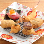 旬の食材を使った極上の串揚げコース。こだわりの薄衣で揚げ、素材の旨味を引き出した至福の逸品を。