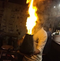 豚バル名物！ボルケーノフランベ 本日の塊
