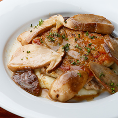 若鶏のコンフィポルチーニ添えの写真