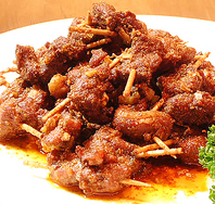 串刺しラム肉のスパイシー炒め