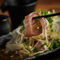 料理メニュー写真 マグロのど肉ねぎまみれ