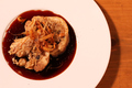 料理メニュー写真 大麦と木の子のガーリックライスを巻いた大山鶏のロースト山葵の香り マデラソース