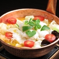 料理メニュー写真 白身魚、トマト、タケノコ、チンゲン菜の酸味煮込み