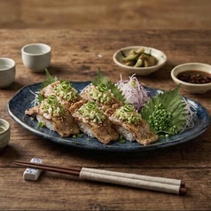 ネギ塩豚カルビ寿司　四貫