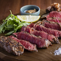 料理メニュー写真 九州産黒毛和牛サーロインステーキまたはリブロース（100g）