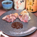 料理メニュー写真 薩摩黒宝豚の炉端焼き～黒ニンニクソースを添えて～