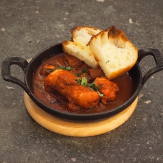 タコのルーチア風（トマト煮込み）