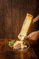 料理メニュー写真 ラクレットチーズかけ手作りソーセージ(3本)