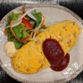 料理メニュー写真&nbsp;チーズオムレツ(自家製トマトソースかけ)