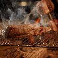 料理メニュー写真 オリーブ牛赤身モモの原始よろず焼き