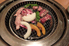 炭火焼肉 錦のロゴ