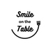 Smile on the table スマイル オン ザ テーブルのロゴ