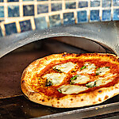 ピッツァの外はサクッと、中はふんわりとした絶妙な食感の写真