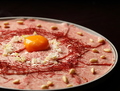 料理メニュー写真 オリーブ牛のカルパッチョ～自家製味噌ソース卵黄添え～